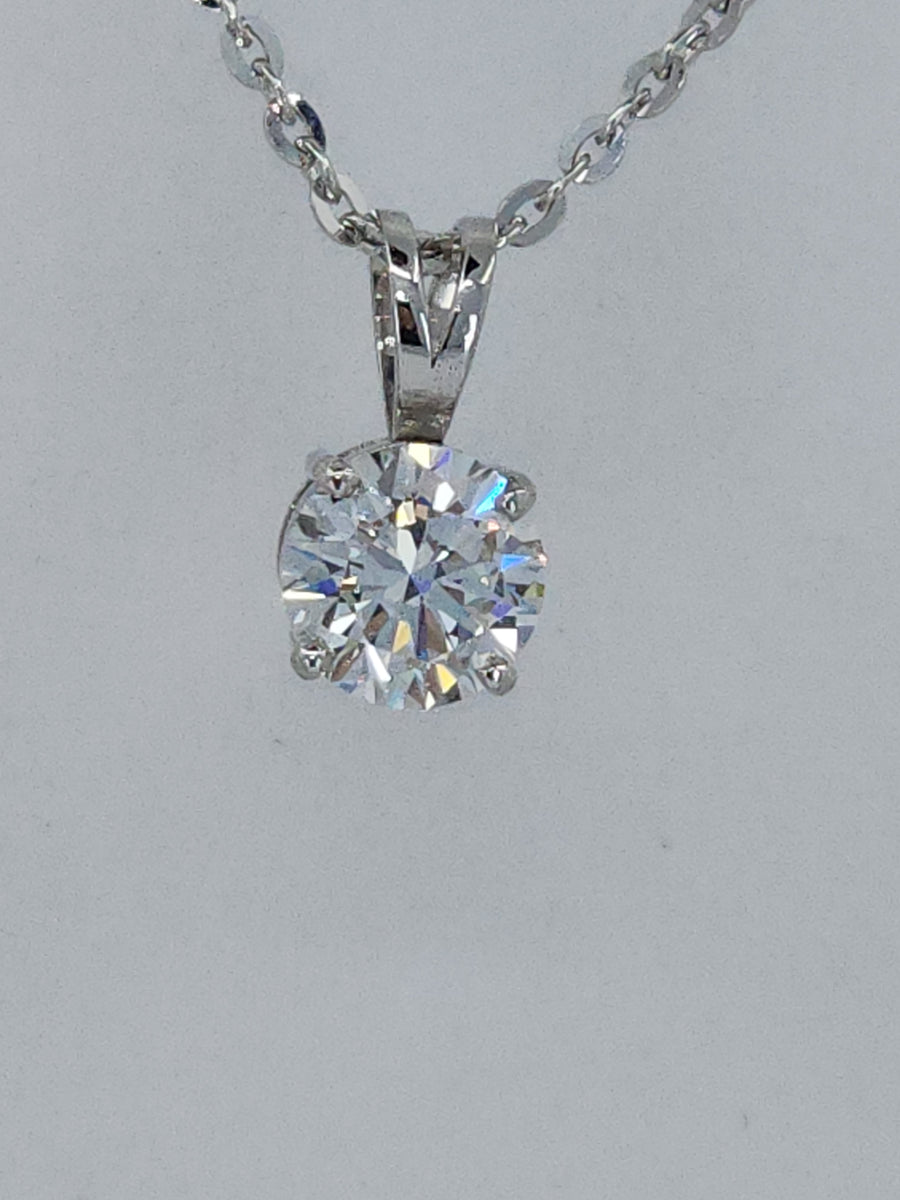An angled view of this breathtaking lab grown diamond solitaire pendant necklace, featuring a 2.02 carat round lab grown diamond on a classic setting. Designed for versatility, this solitaire lab grown diamond necklace offers a radiant sparkle, making it an ideal choice for those searching for a sophisticated and ethical lab grown diamond necklace.
