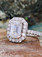 Front-facing view of the 2.31 carat lab grown emerald diamond ring in natural light, enhancing its step-cut facets and detailed halo.

