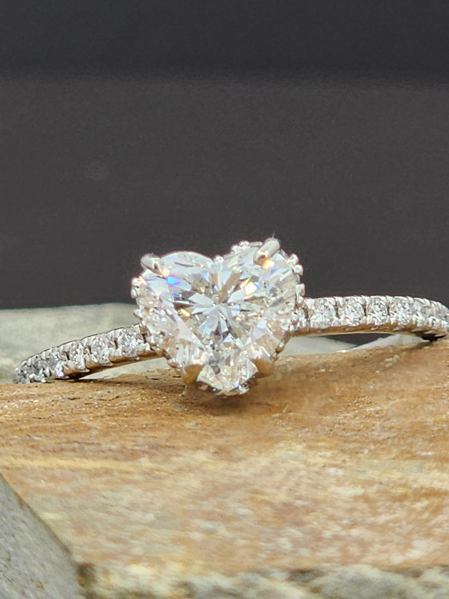 Lab grown heart shaped diamond ring 1 carat viewed from the side, highlighting the clean band and elegant diamond setting