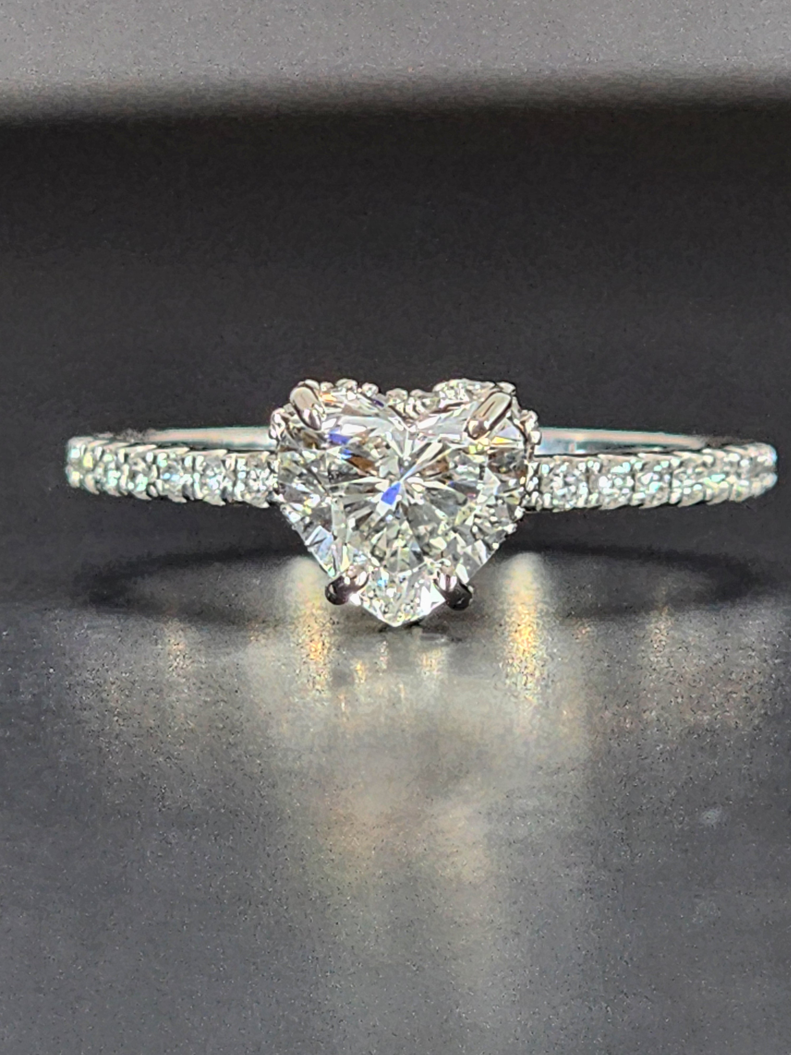 Lab grown heart shaped diamond ring 1 carat viewed from the side, highlighting the clean band and elegant diamond setting